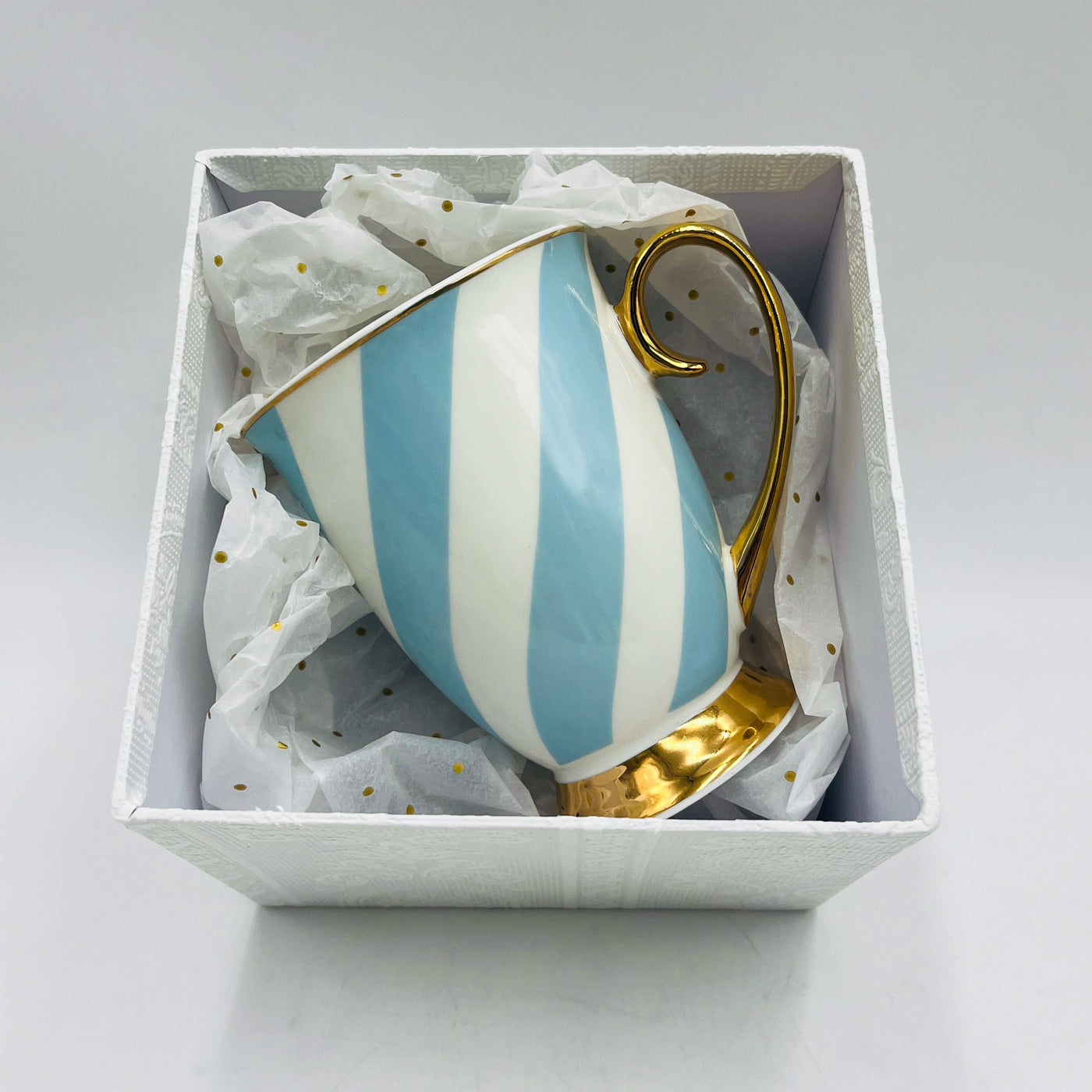 taza-porcelana-rayas-azul-dorado
